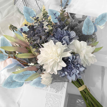 Bouquet of flowers with white, blue, and green colors on a light background